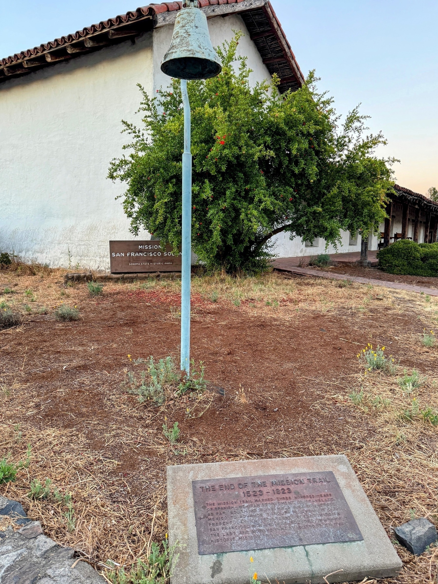 Mission San Francisco Solano in Sonoma with a historic marker for the end of El Camino Real in the foreground